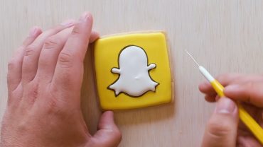 Picture of a person making a Snapchat cookie.