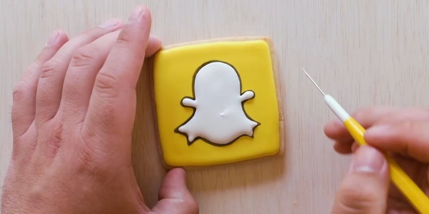 Picture of a person making a Snapchat cookie.